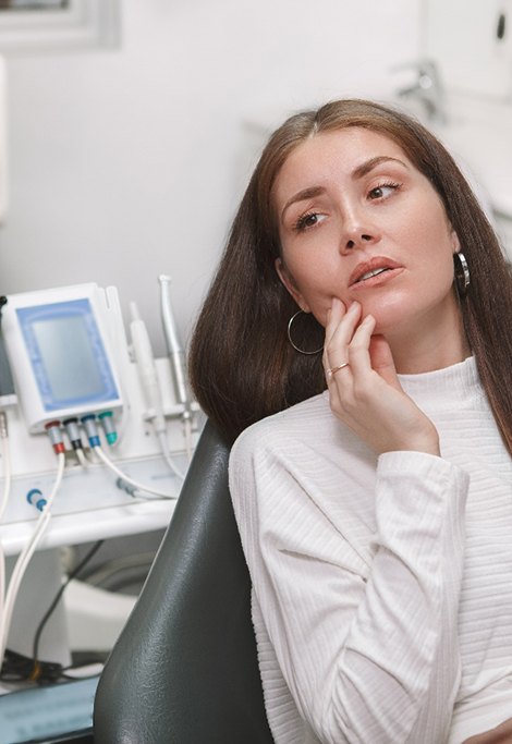 An attractive young woman seeing a dentist for a dental emergency