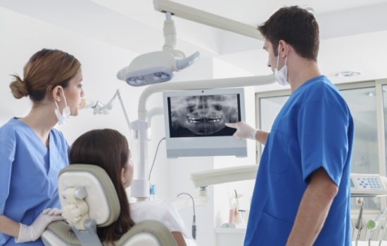 Dentist showing a patient their dental x rays