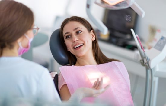 Woman talking to her dentist