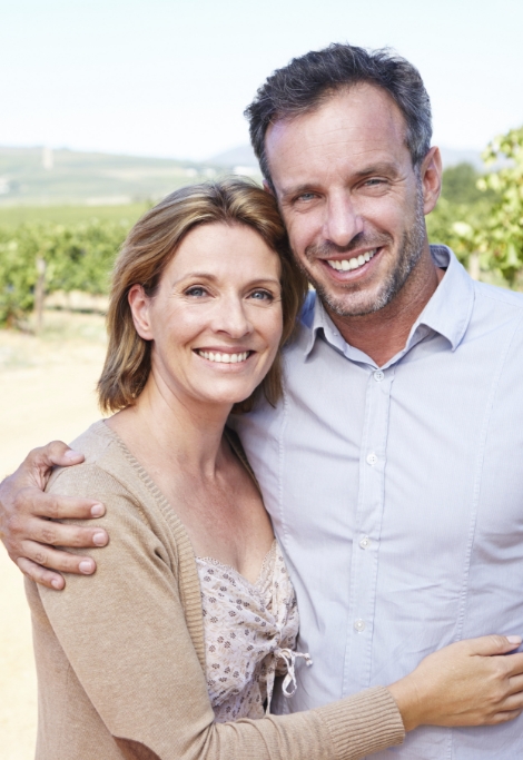 Smiling man and woman with amalgam free dental fillings in Shelburne