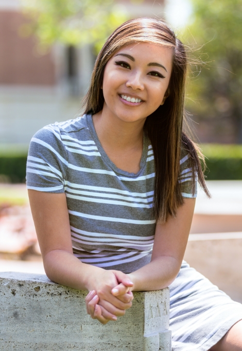 Young woman smiling with metal free dental restorations in Shelburne