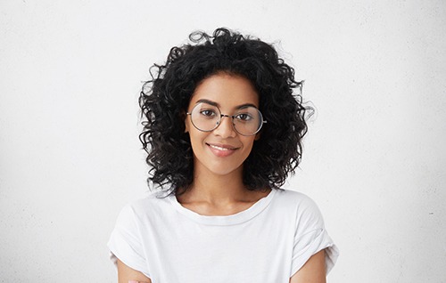 Portrait of smiling woman in white t-shirt