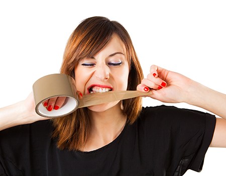Patient in Shelburne biting tape and risking dental emergencies